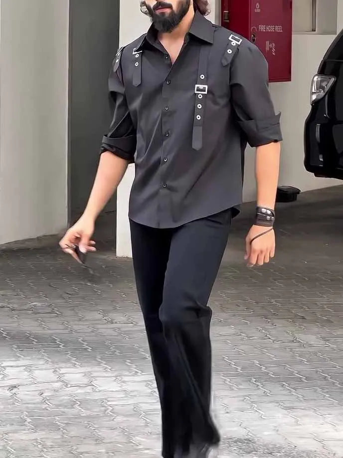 Man wearing a black utility-style button-up polyester shirt with a regular fit.