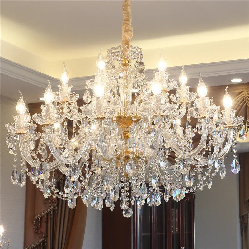 Crystal chandelier ceiling light with glass body and multiple LED lights over a living room