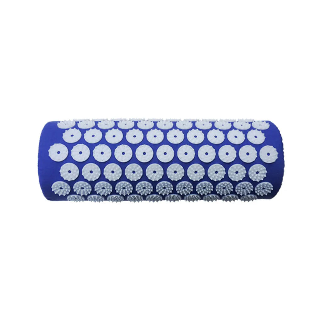Black and blue acupuncture massage mat with cushion and headrest on floor
