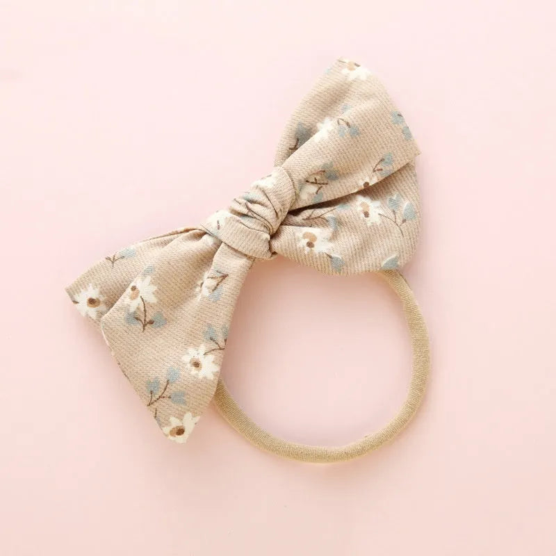 Children's cloth knotted bow hair ring in a Snow White princess design.