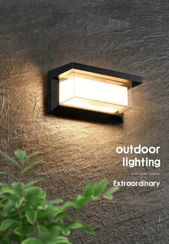 IP65-rated outdoor wall light with acrylic lampshade and aluminium body for garden use.