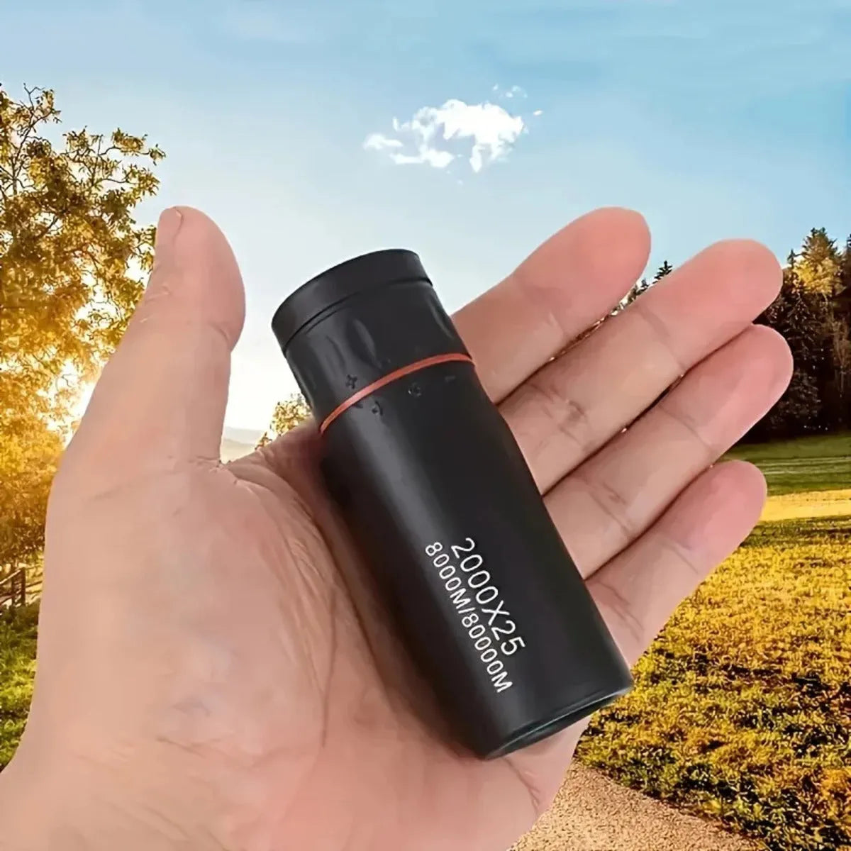 Black monocular telescope with rubber exterior and mobile phone holder attachment for outdoor use