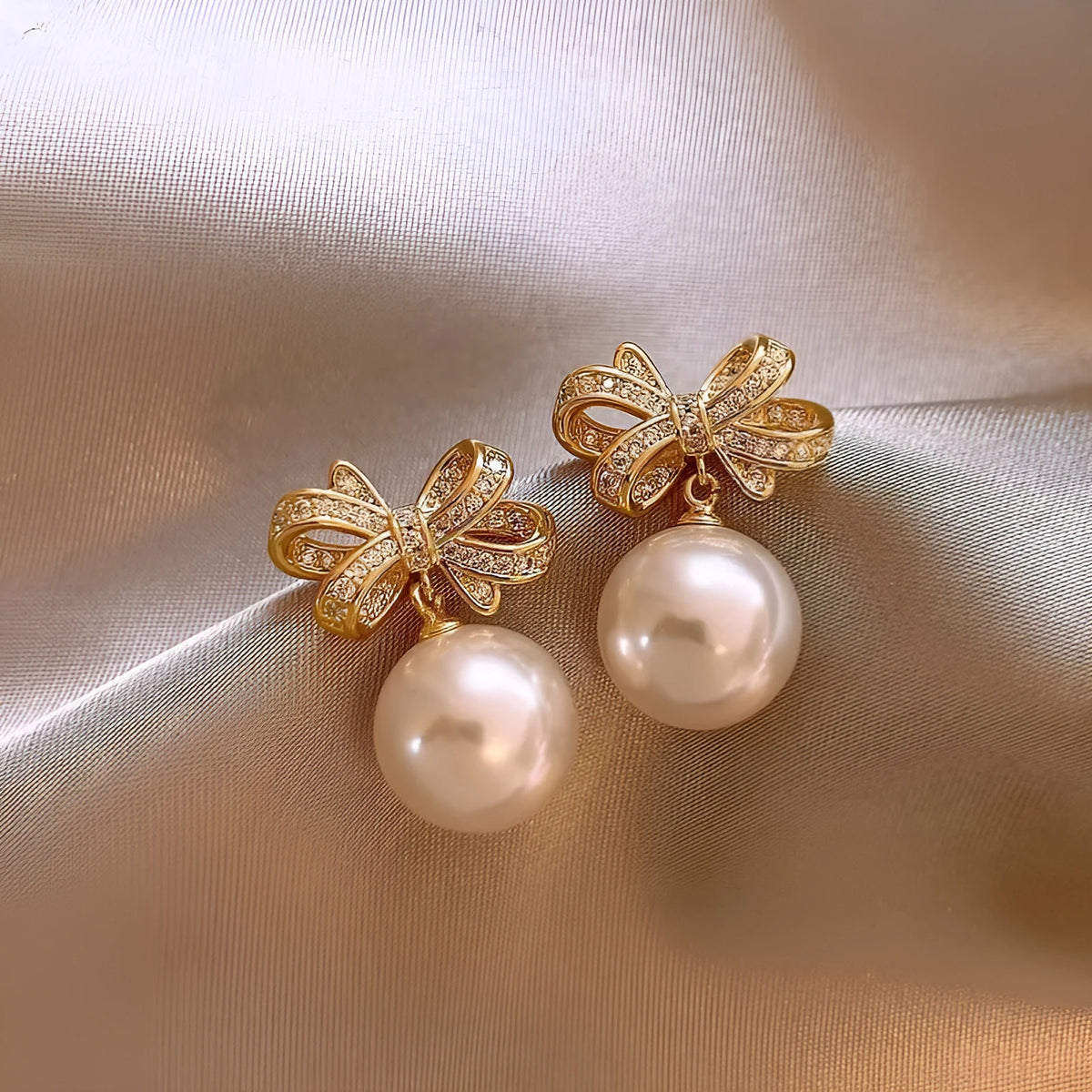 Gold tone bow pearl stud earrings, 12mm alloy women's earrings supplied as one pair