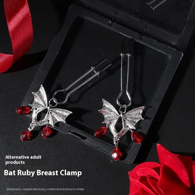 Silver alloy bat nipple clamp with adjustable tension and ruby detailing