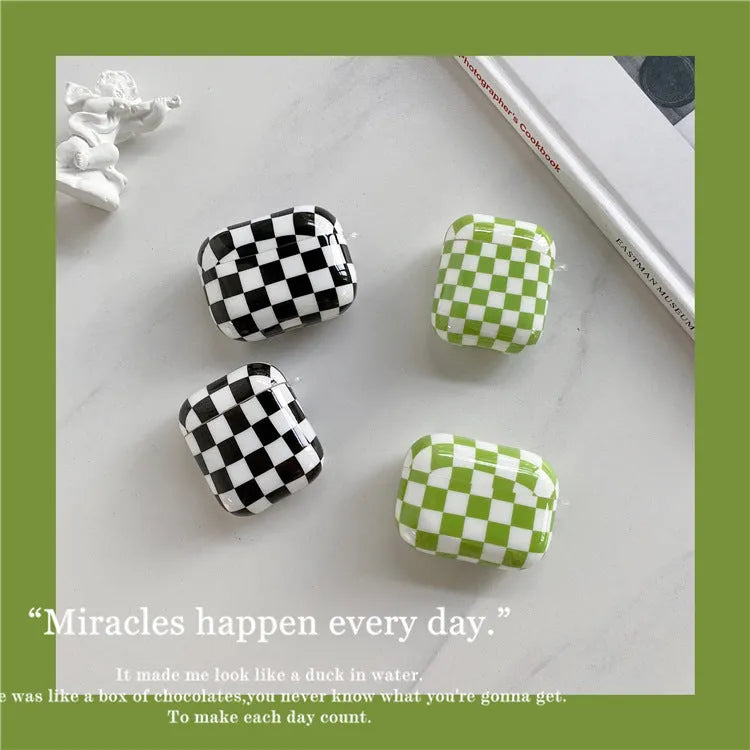 Black and green checkerboard pattern TPU protective cases for Apple AirPods with lanyard and loop pendant options.