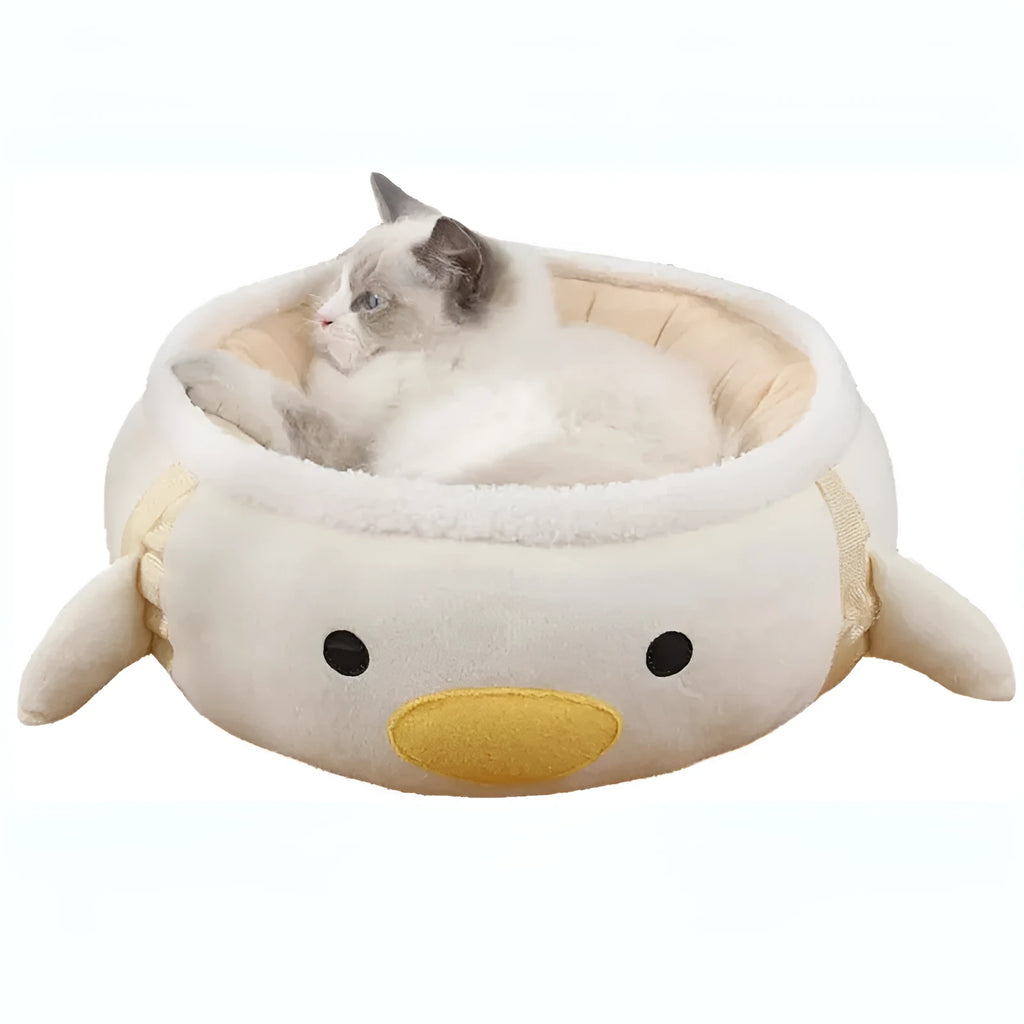 Green dinosaur-shaped cat bed shown both flat as a sofa and hung as a hammock for small pets.
