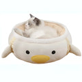 Green dinosaur-shaped cat bed shown both flat as a sofa and hung as a hammock for small pets.