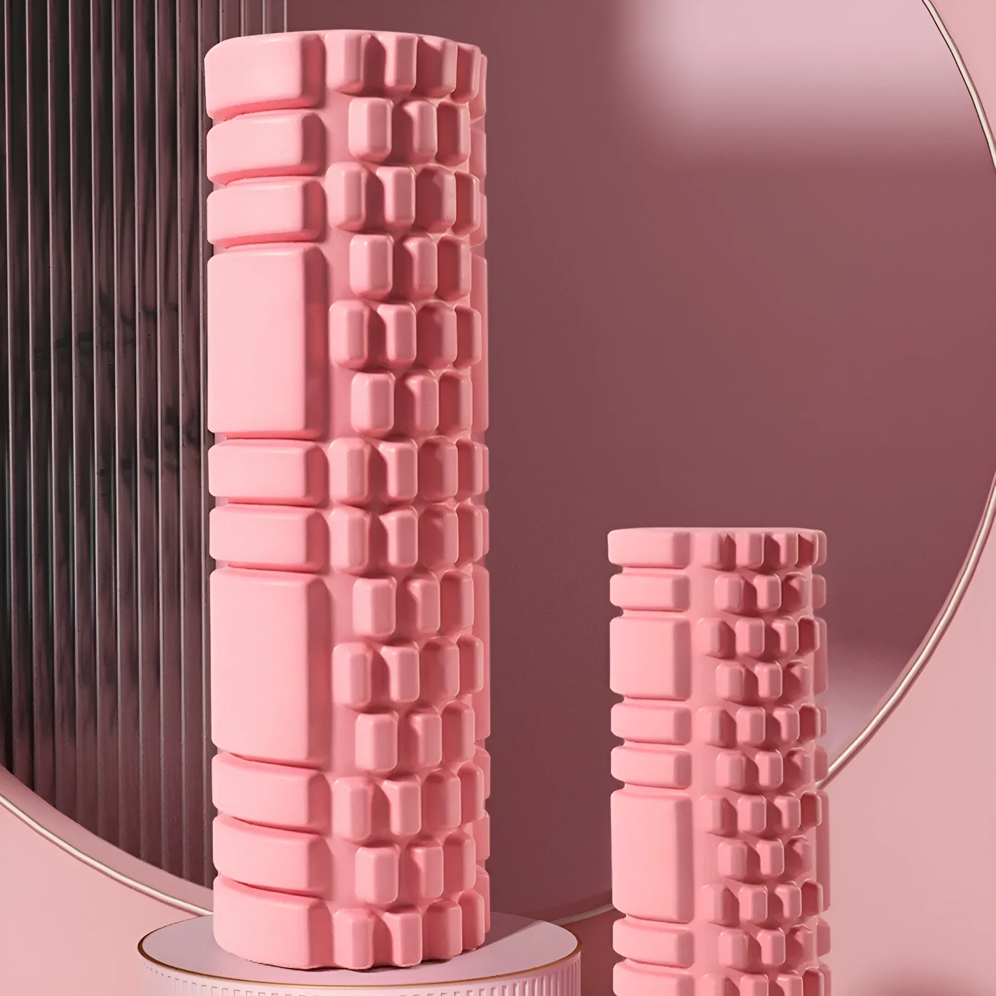 A firm EVA foam roller for fitness and yoga, shown in a selection of colours including black, pink, and sky blue.