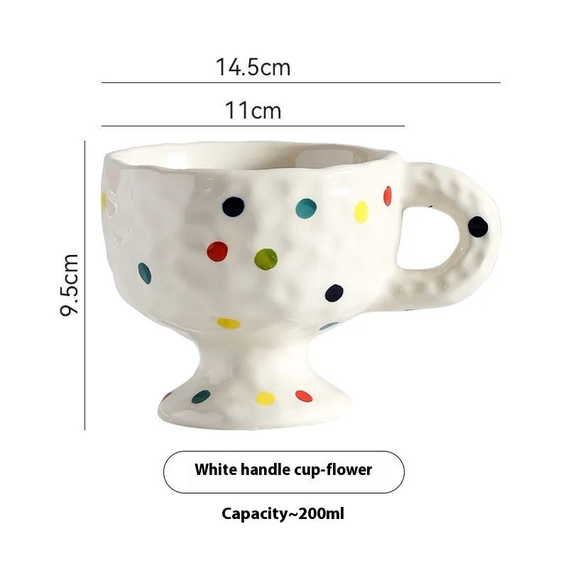 Handmade irregular solid colour ceramic mug on a table