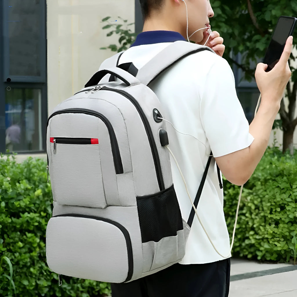 Light grey Oxford cloth insulated backpack with curved shoulder straps and a pull rod belt.