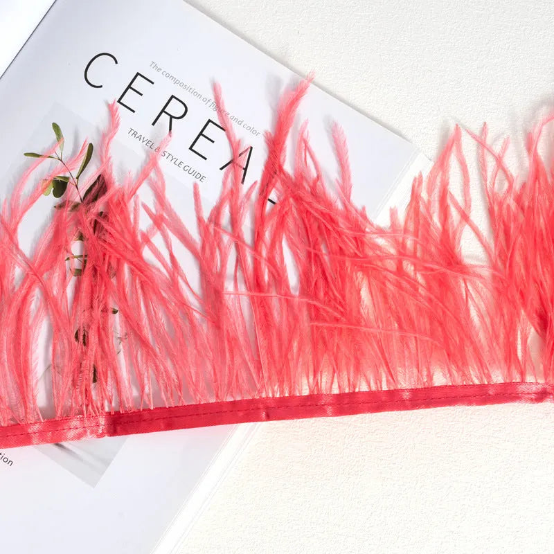 Decorative feather cloth strip in multiple colours including white, black, and mint green for DIY clothing and craft projects