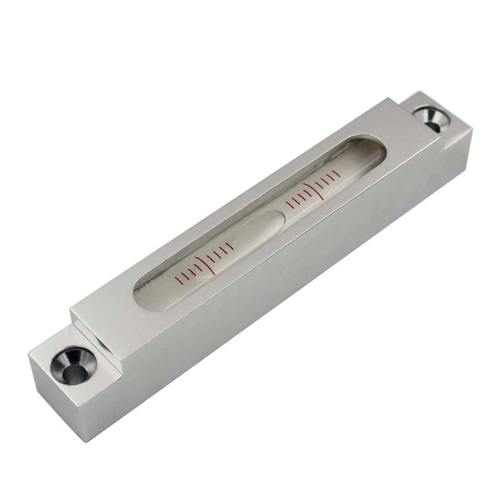 Metal and glass mini strip level showing precision vial on a 132mm long ruler.