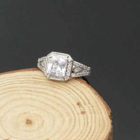 Geometric hollow zircon ring with quadrilateral design in platinum colour on copper