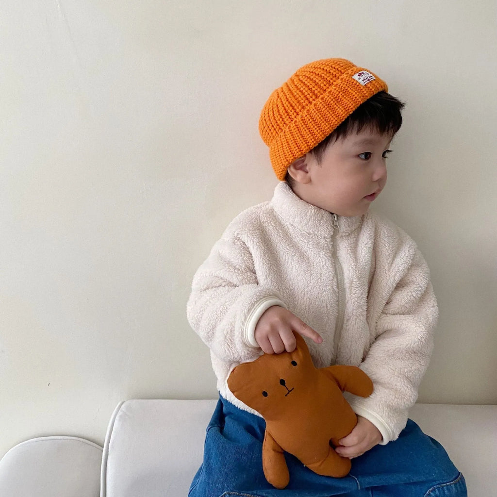 Blue children's sherpa fleece zip-up jacket with a high collar and front pockets.