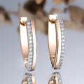 Women's V-shaped geometric ear clips in champagne gold white diamond finish