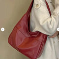 Women's soft PU shoulder bag in European retro style with zipper compartment and sewing thread details