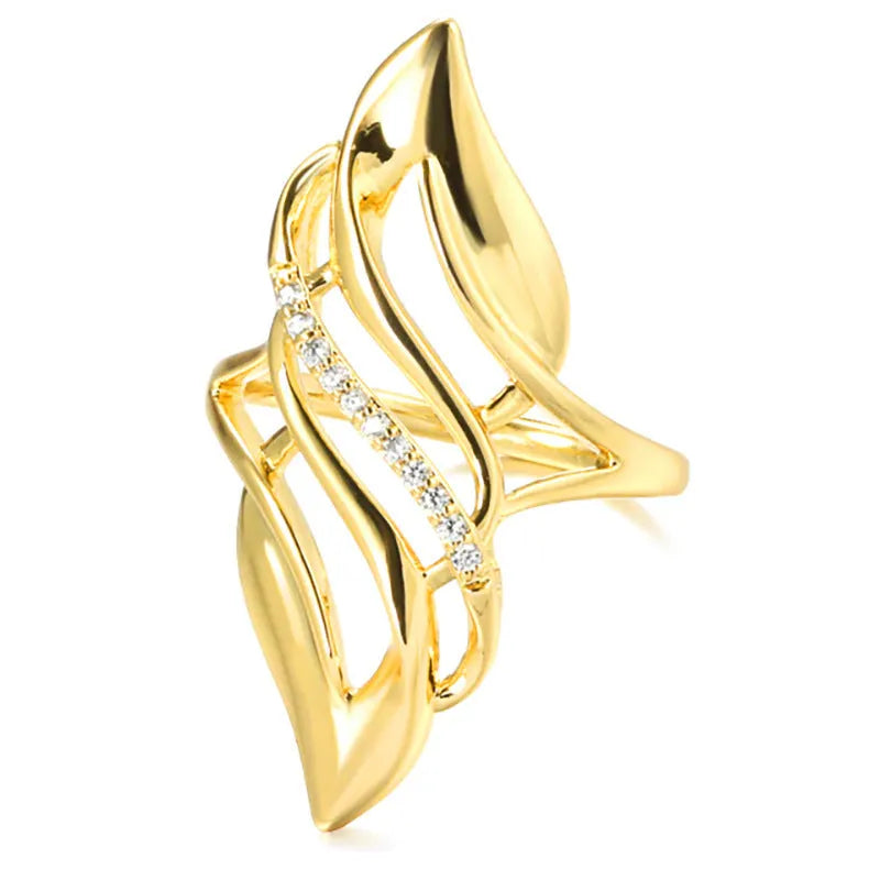 Women's exaggerated curve statement ring in gold colour with bold design on finger