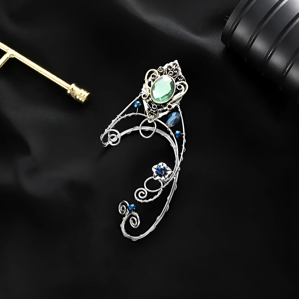 Green crystal non-piercing ear clip hand-woven original design mixed material on white background
