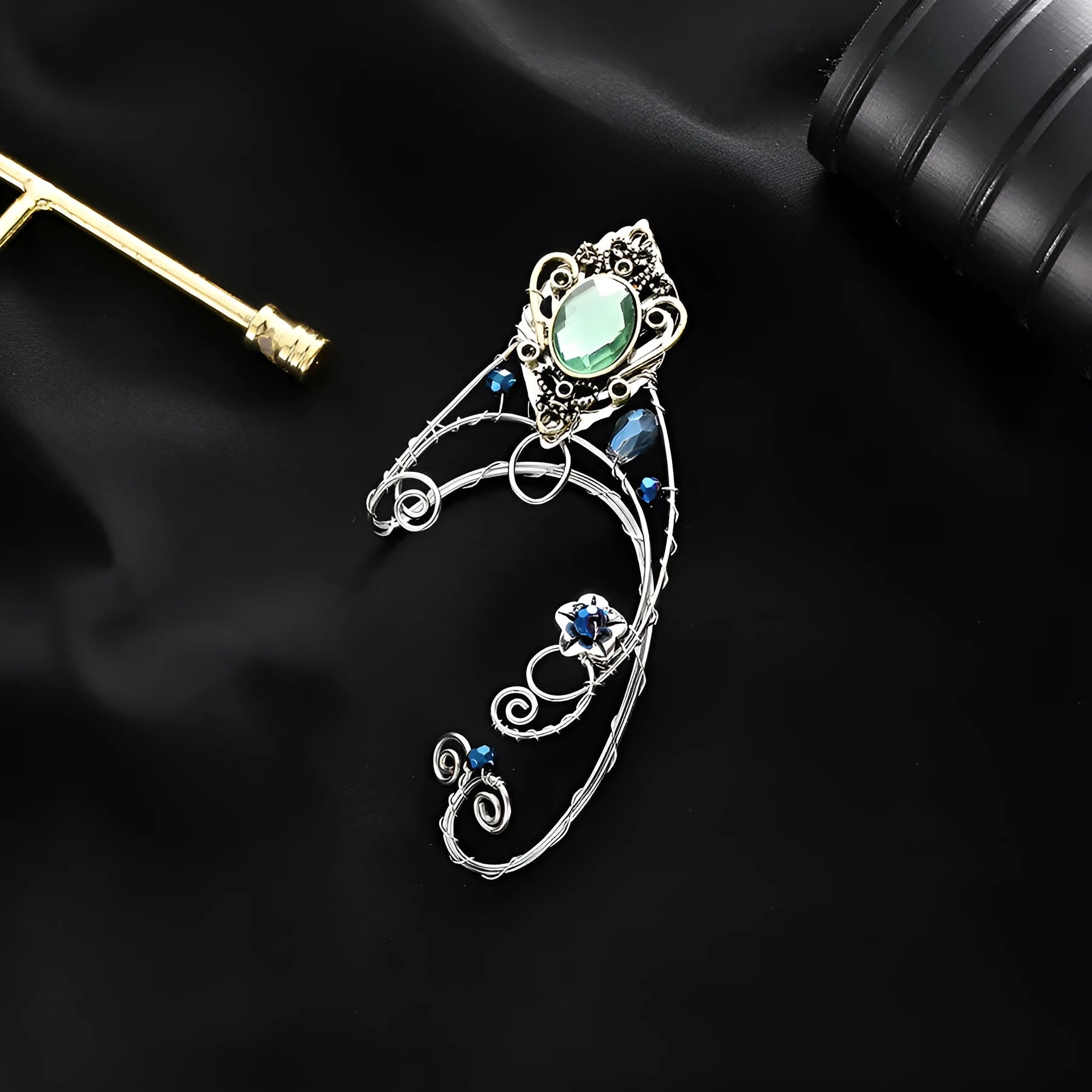 Green crystal non-piercing ear clip hand-woven original design mixed material on white background