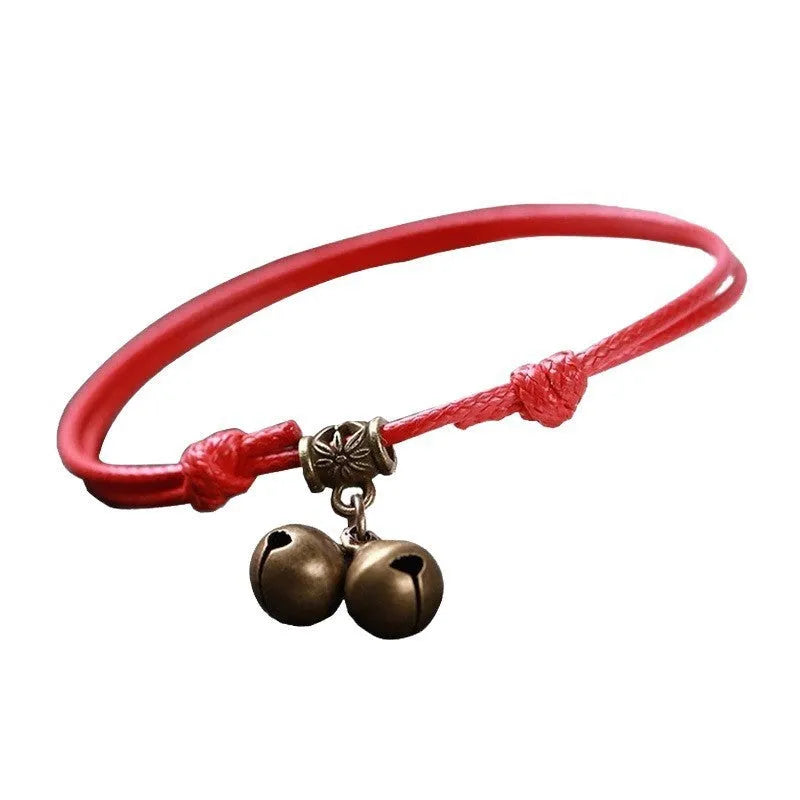 Adjustable nylon rope dog collar with brass bell, shown in black colour on a size guide