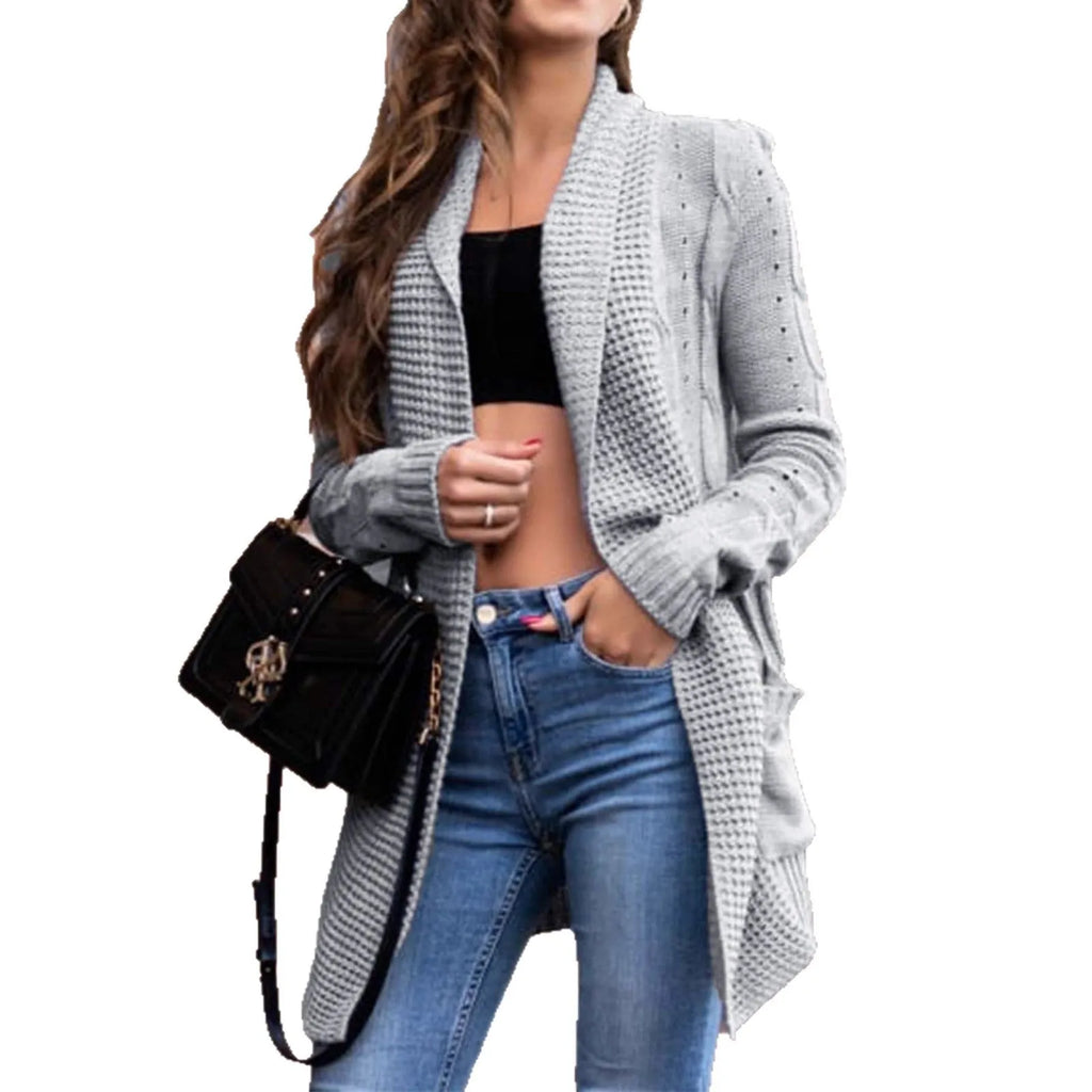 Women's loose fit grey cardigan coat with front pockets showing 65cm medium length