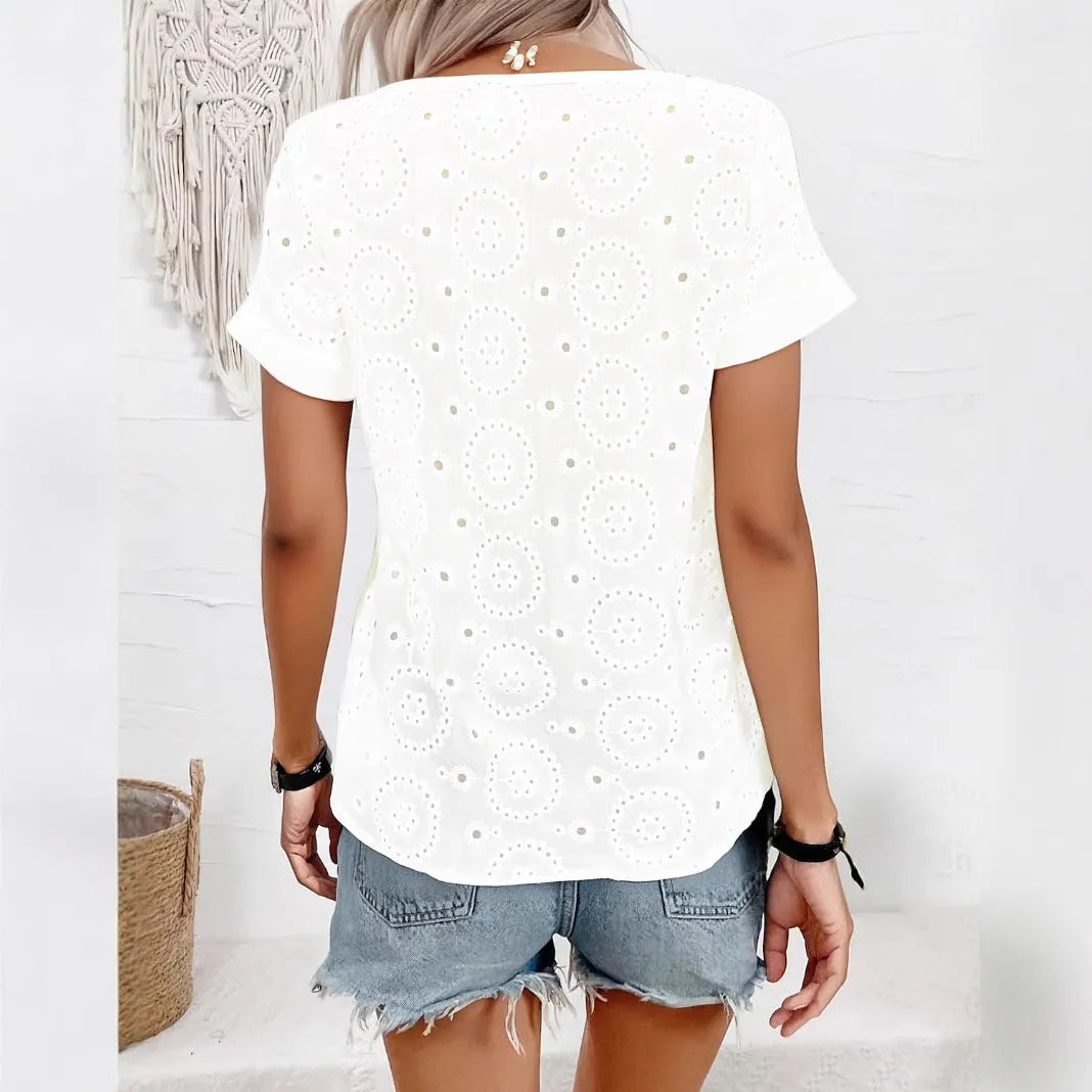 White loose V-neck T-shirt with decorative hollow-out pattern on the short sleeves.