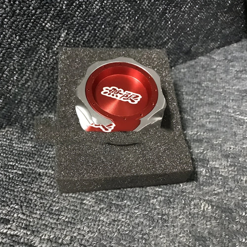 Aluminium alloy oil filter cap for Honda vehicles in assorted colours on a dark background.