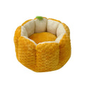 Pumpkin-shaped orange cat nest with raised sides and cotton filling in two size options