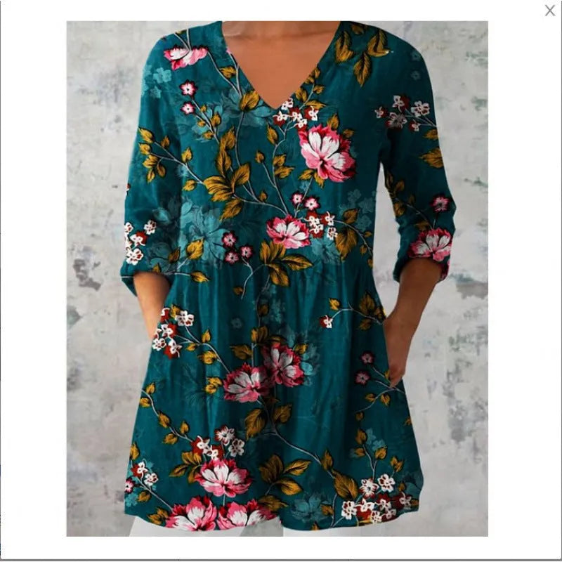 Women's printed loose dress with wide waist and three-quarter length sleeves on a hanger.