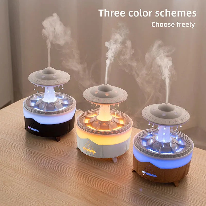 White UFO-shaped cloud humidifier with mist and soft blue night light on a wooden table