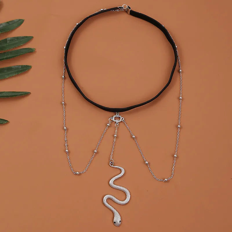 Women's white pearl multi-layer geometric body chain anklet on a light background