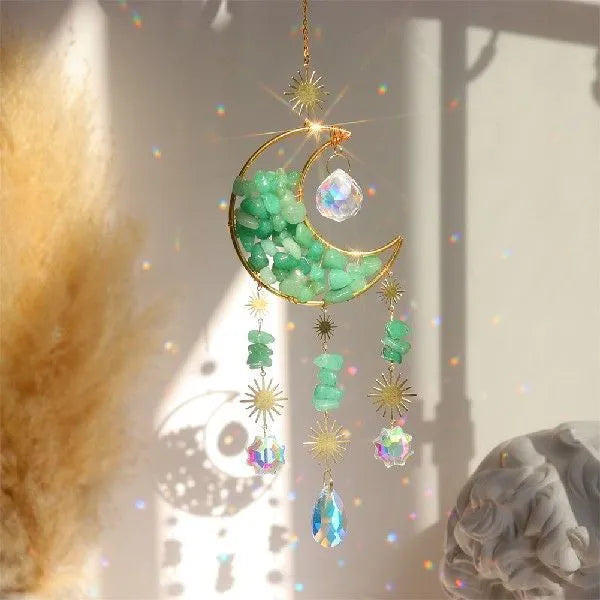 K9 crystal moon-shaped car pendant hanging, showing reflective surface in a choice of colours.