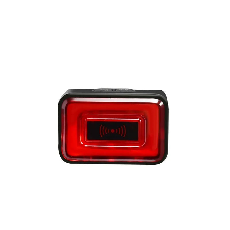 Smart bicycle rear safety light with radar detection mounted on a bike seat post, showing compact black housing.