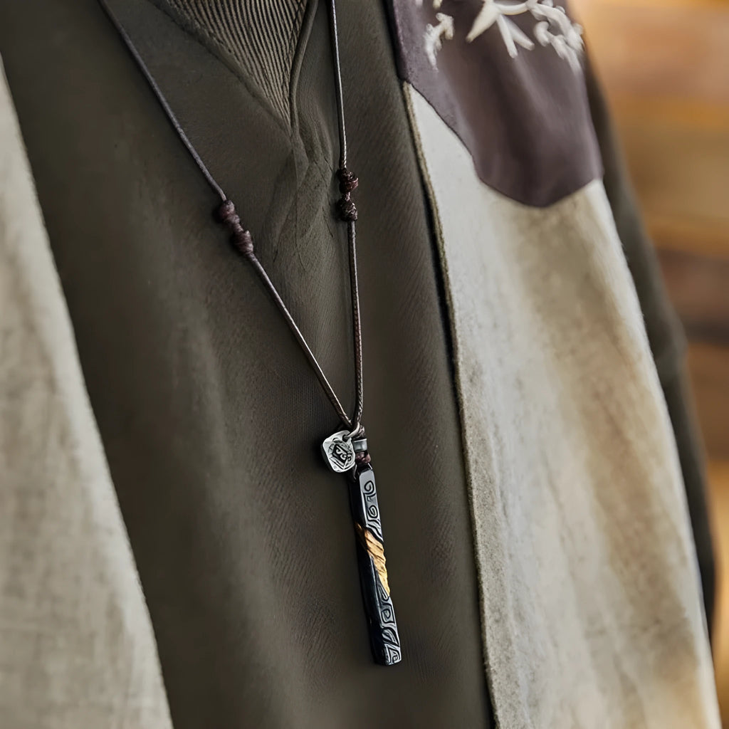 Handmade sterling silver men's necklace with gold inlay and gemstone detail