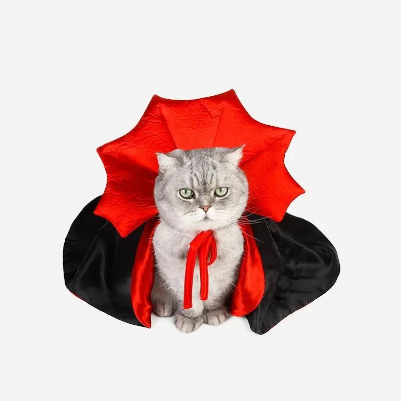 Small black pet vampire cloak costume for dog or cat on hanger with S M L size tags.