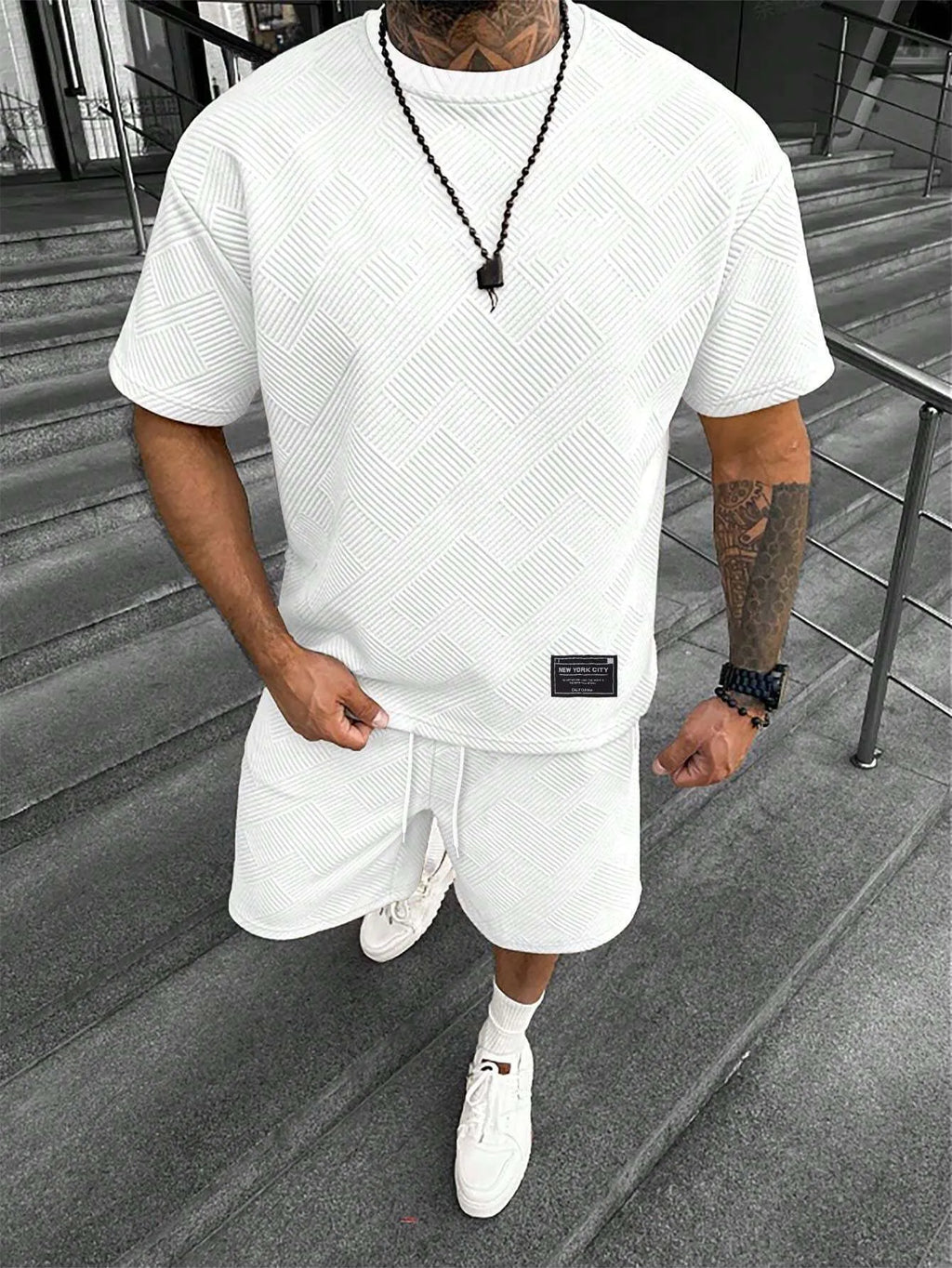Men's short sleeve top and shorts suit with 3D printed pattern for sport and leisure wear.
