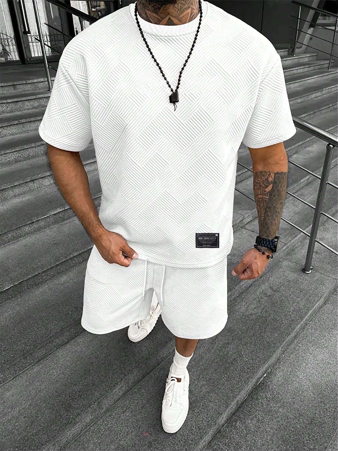 Men's short sleeve top and shorts suit with 3D printed pattern for sport and leisure wear.