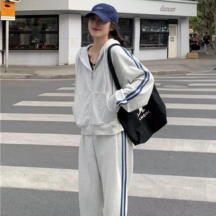 Women's striped two-piece trouser suit set in light grey or black, polyester, sizes M to XXL