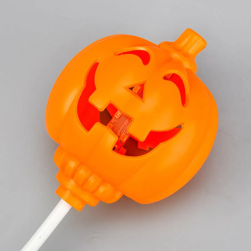 USB rechargeable plastic pumpkin lamp with purple or yellow LED lighting measuring 8.3cm diameter