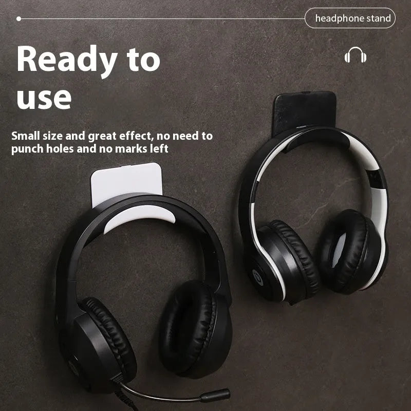 Black plastic headphone bracket mounted on wall with universal fit for headset storage