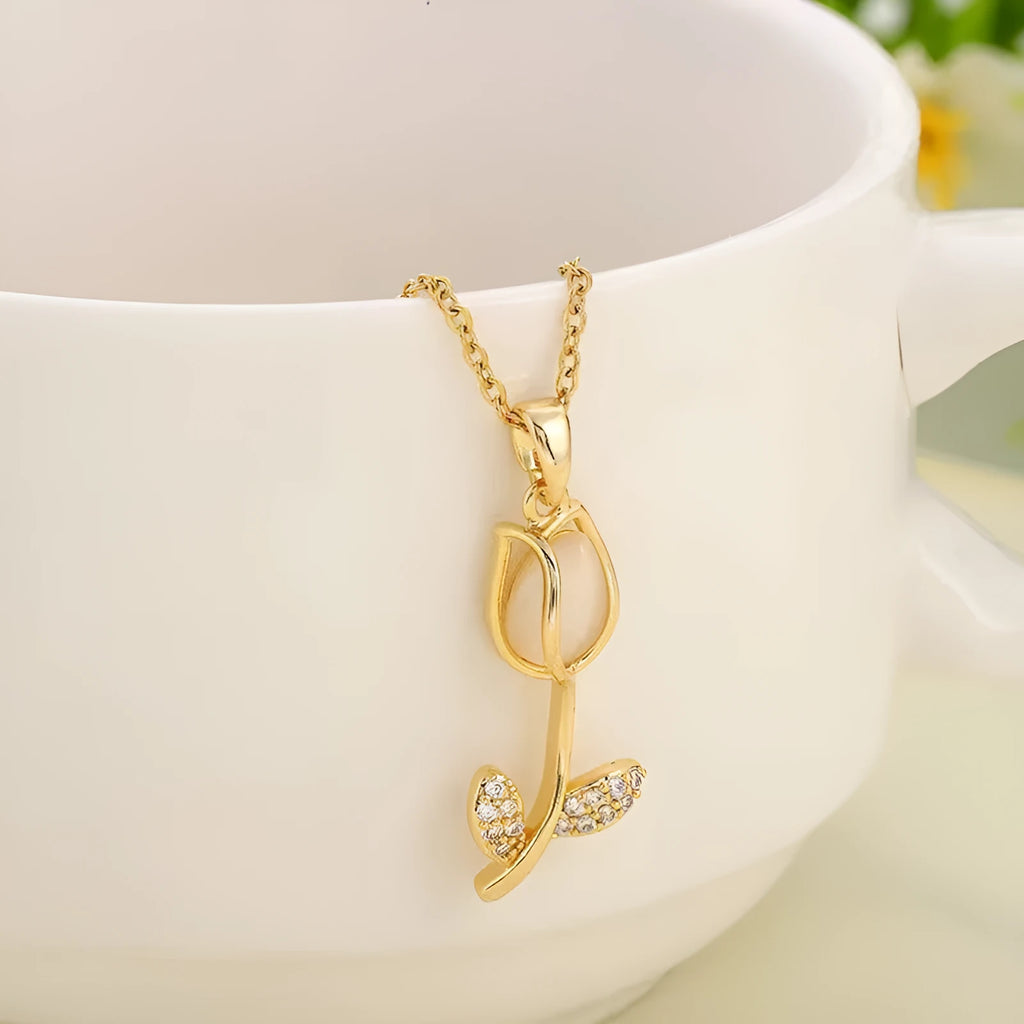 Gold tulip pendant necklace with zircon stones on an adjustable O-ring chain, showing colour options.