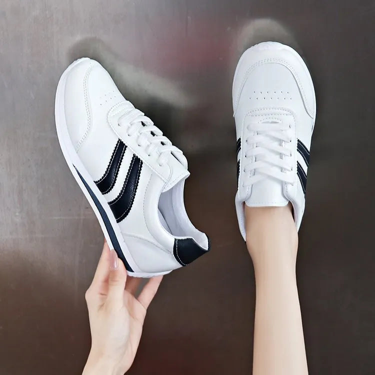 Blue casual lace up soft bottom sneaker with rubber sole and round toe, low top design