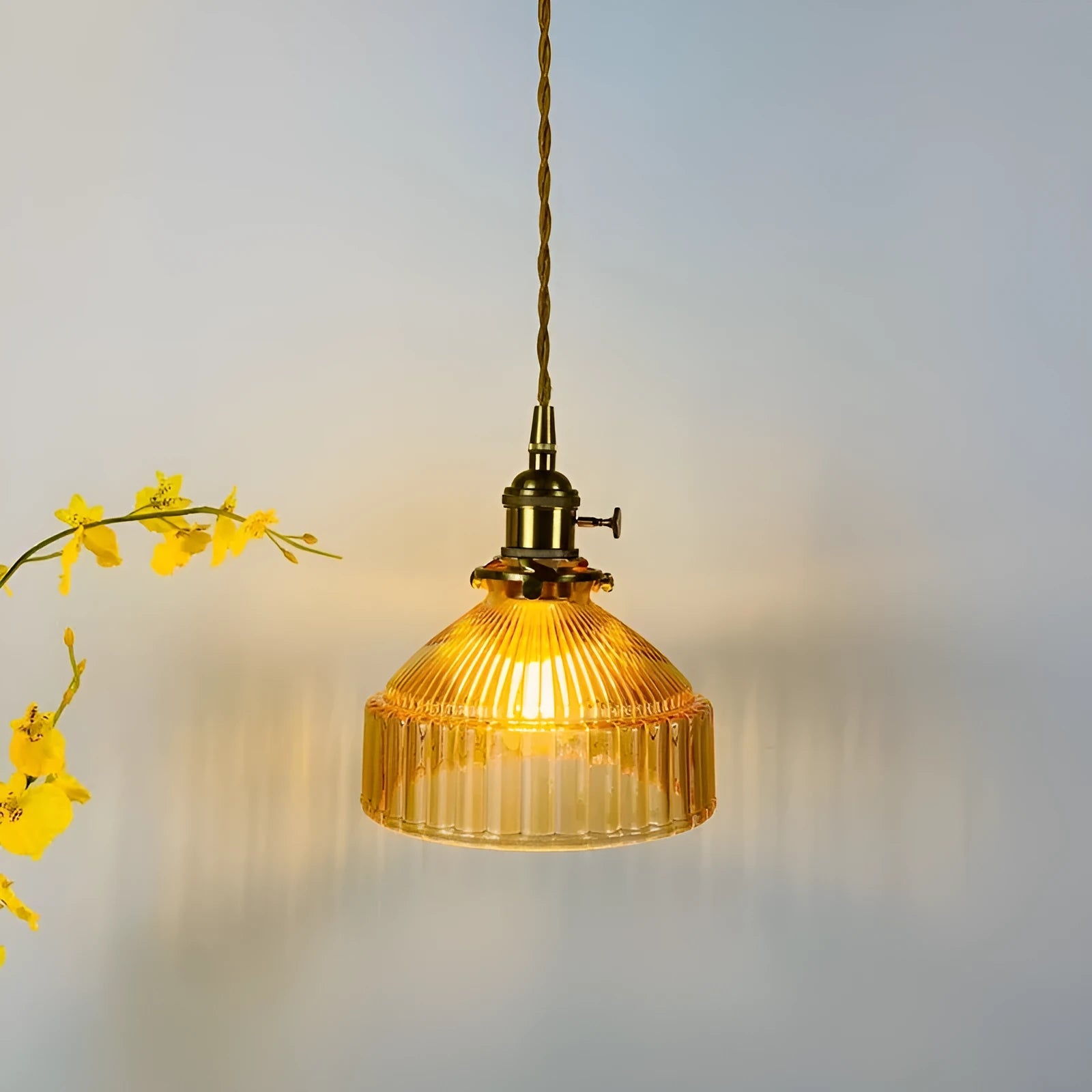 Nordic-style brass and glass chandelier light fixture with an adjustable cord.