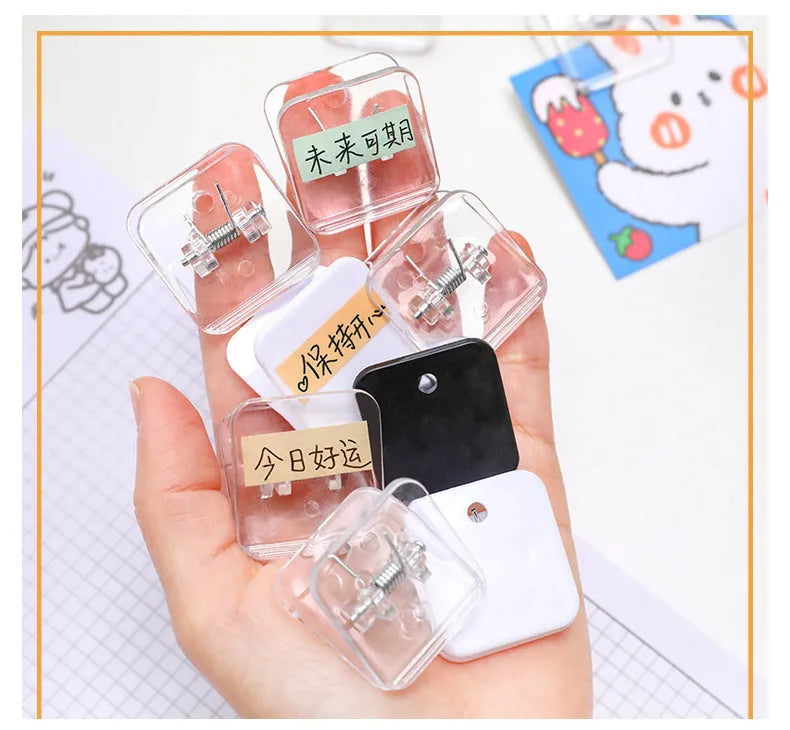 Square plastic photo memo holder in black, white, or transparent on a desk.
