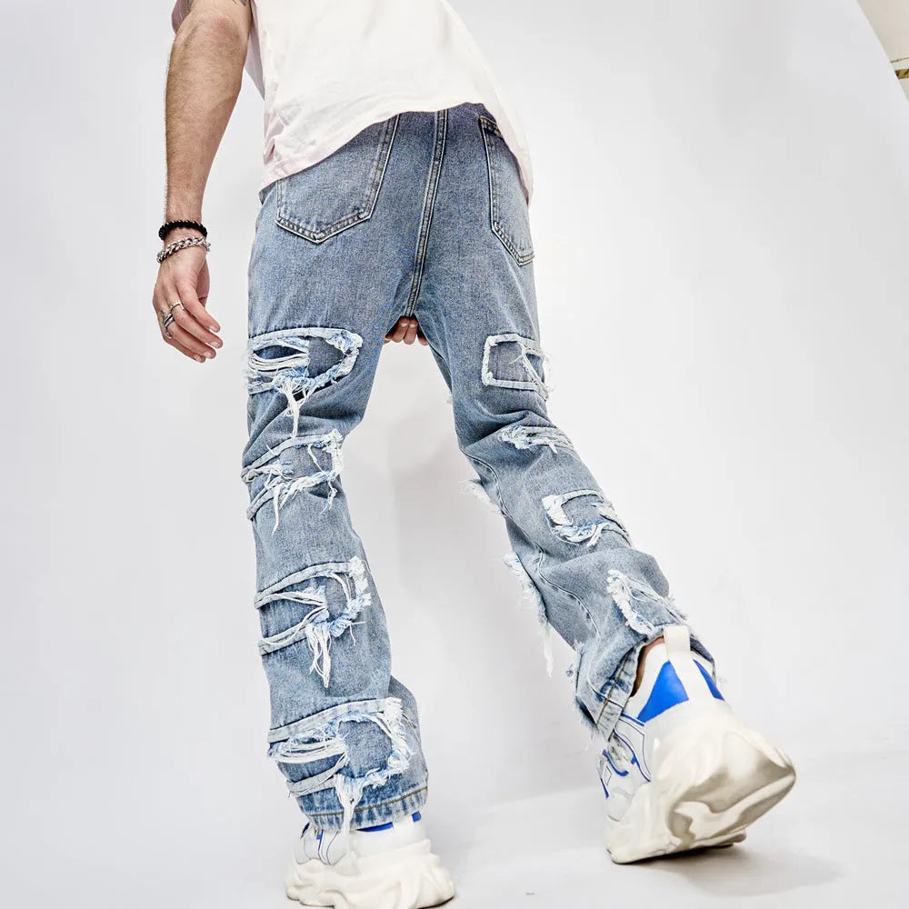 Men's blue cotton full length patched straight fit hip hop jeans on model