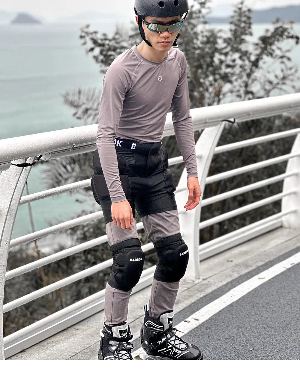 Black adult roller skating hip protection shorts with integrated NBR foam armour panels.