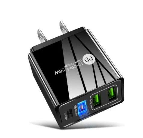 Black and white dual USB travel charger with international plug options showing indicator light