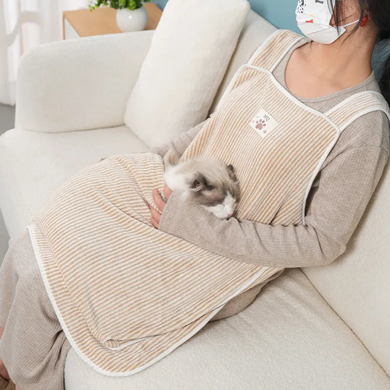 Cloth cat petting apron in a striped pattern, shown worn by a person holding a cat.
