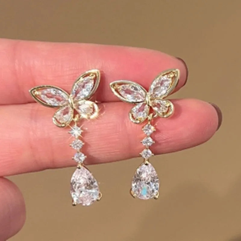 Bow shape stud earrings in platinum colour with electroplated finish on zinc alloy