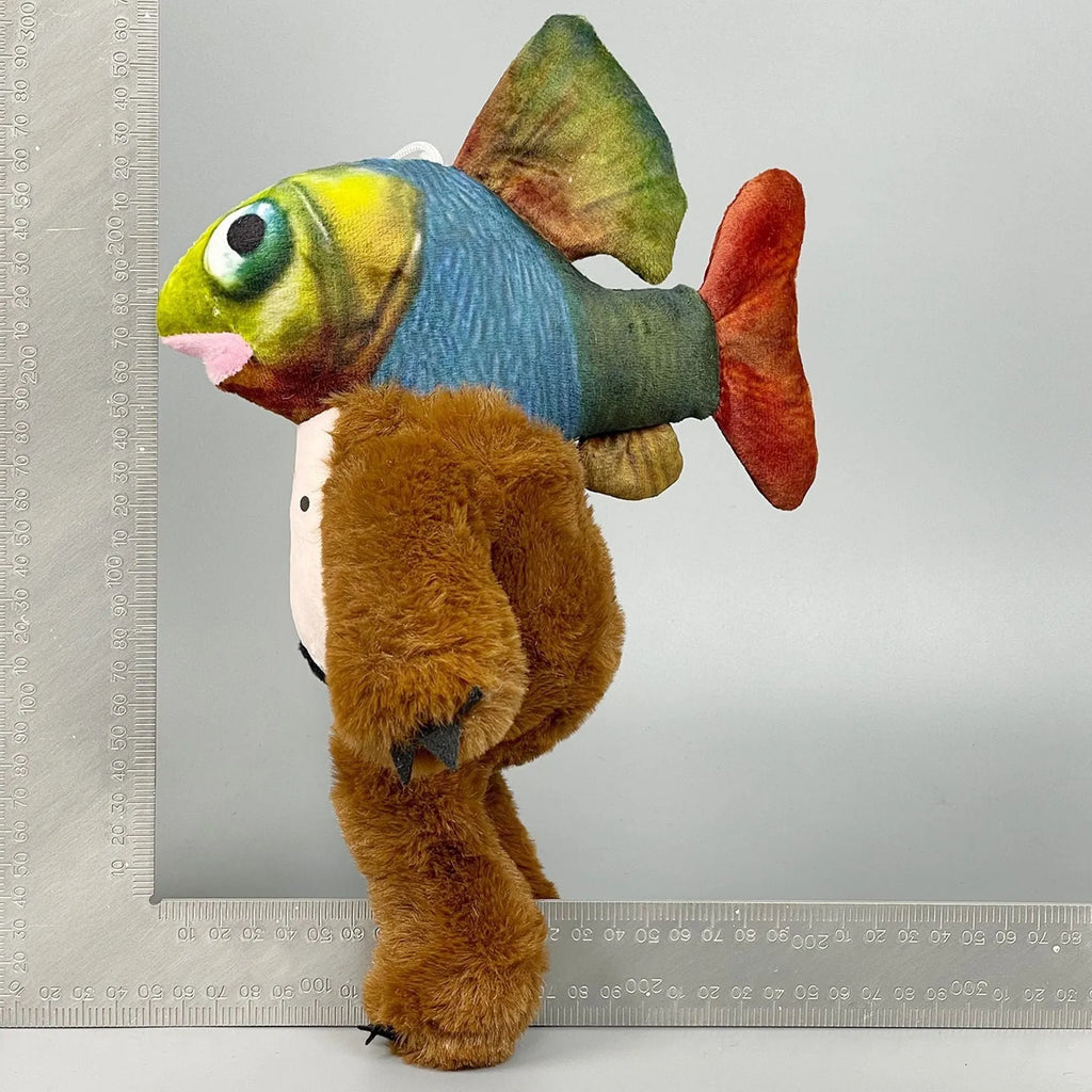 Shark figurine plush toys collection showing shark running shoes, orange muscle men, and cactus elephant designs